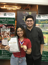 Holding a certificate and medal